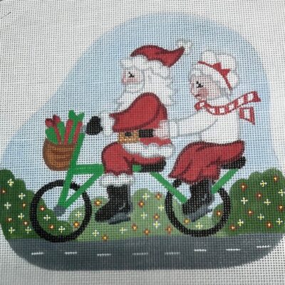 Santa and Mrs. Claus Riding a Bike